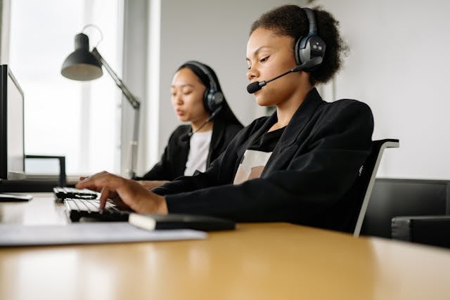 Two woman working at a call center